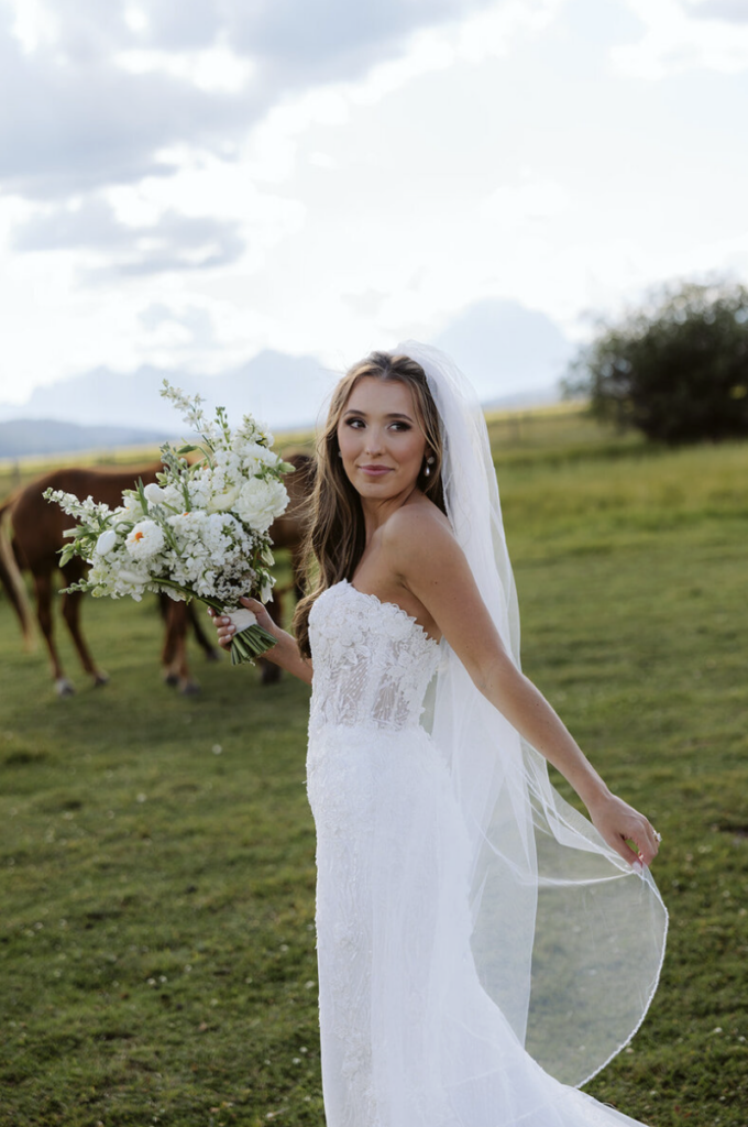Gorgeous bride in the mountains who properly followed a mountain wedding skincare routine