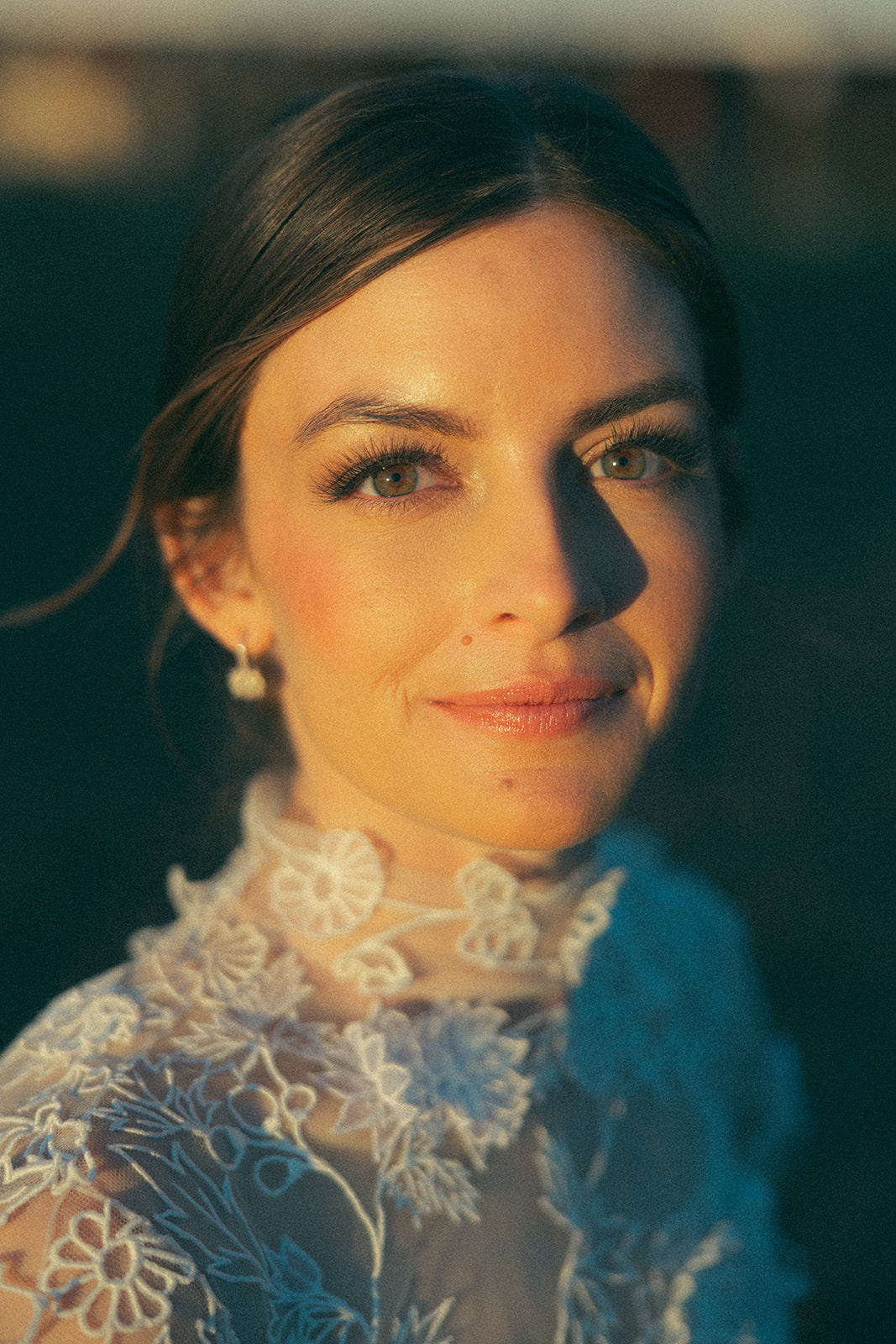 Mountain wedding skincare is absolutely glowing in this golden hour bridal portrait