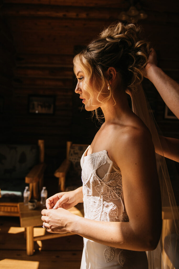 Golden hour with bride getting Jackson Hole wedding hair and makeup done