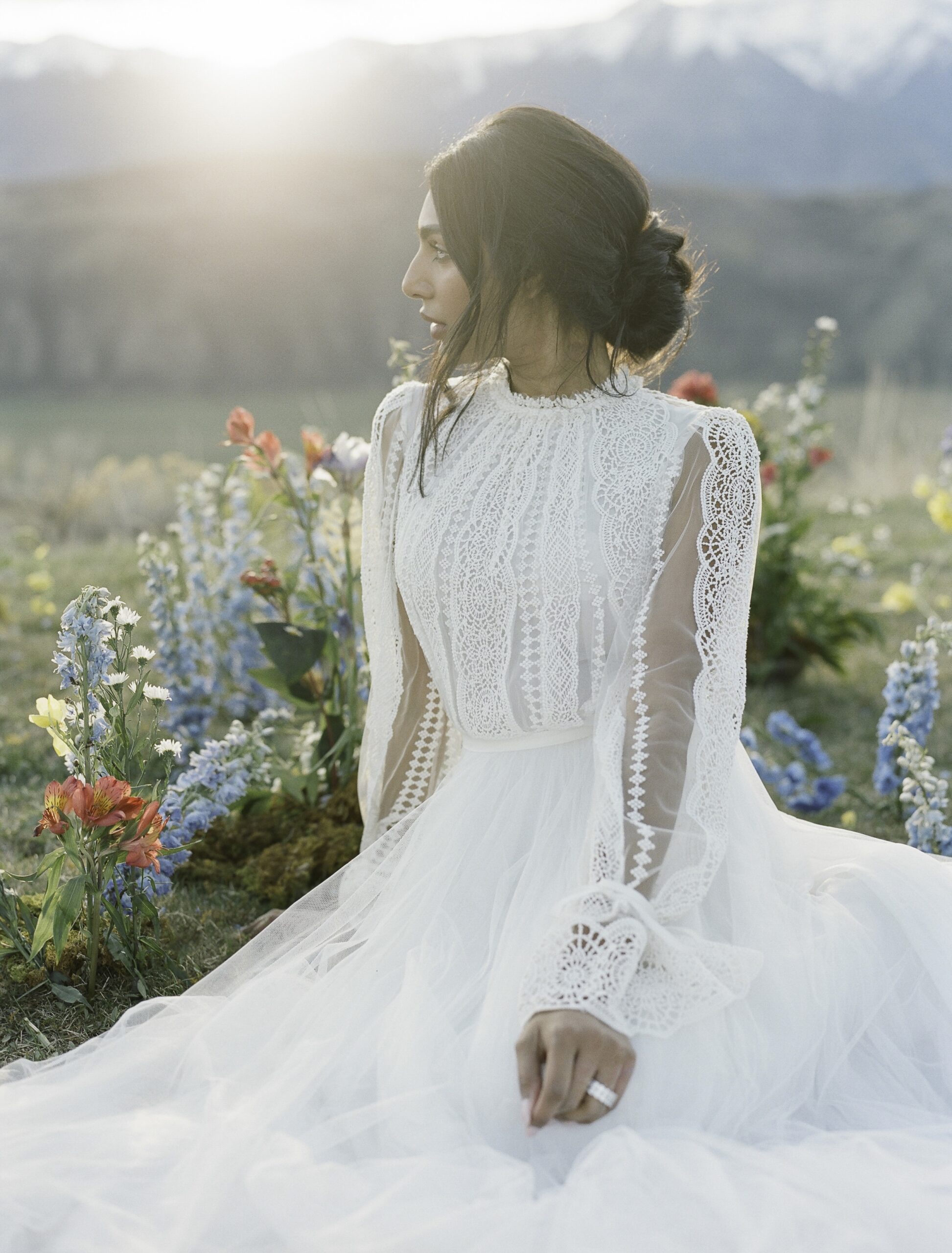 Beautiful mountain sunset with Jackson Hole wedding hair and makeup complete